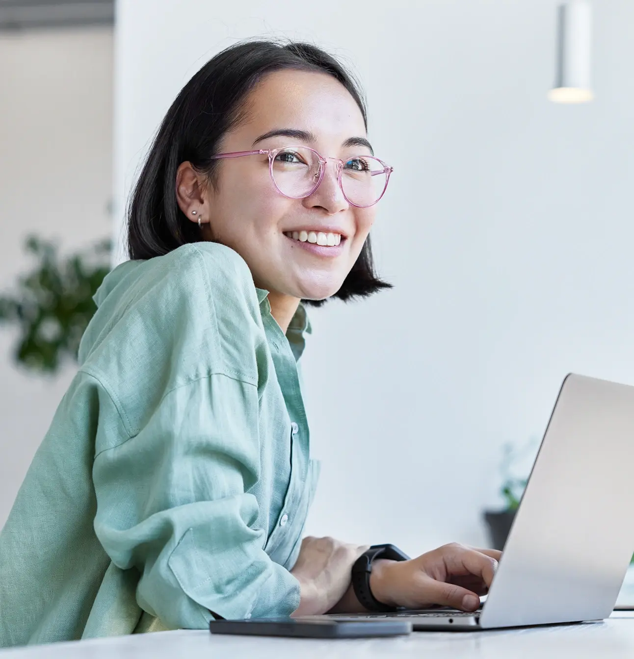 Dental professional working on a laptop